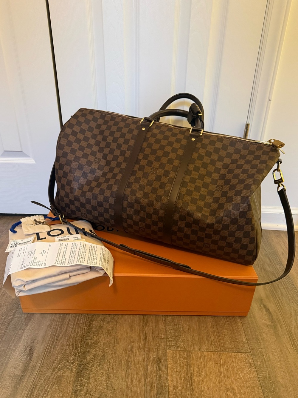 Authentic Louis Vuitton Keepall Bandoulière 55 duffle bag in Damier Ebène